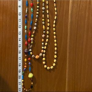 3 Beautiful Beaded Necklaces. Made of recycled newspaper + wax. Beads for life